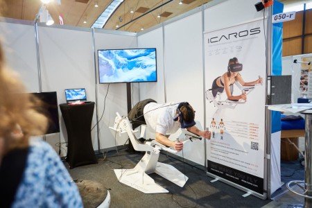 One person tries out a product from an exhibitor at the Future Pavilion.